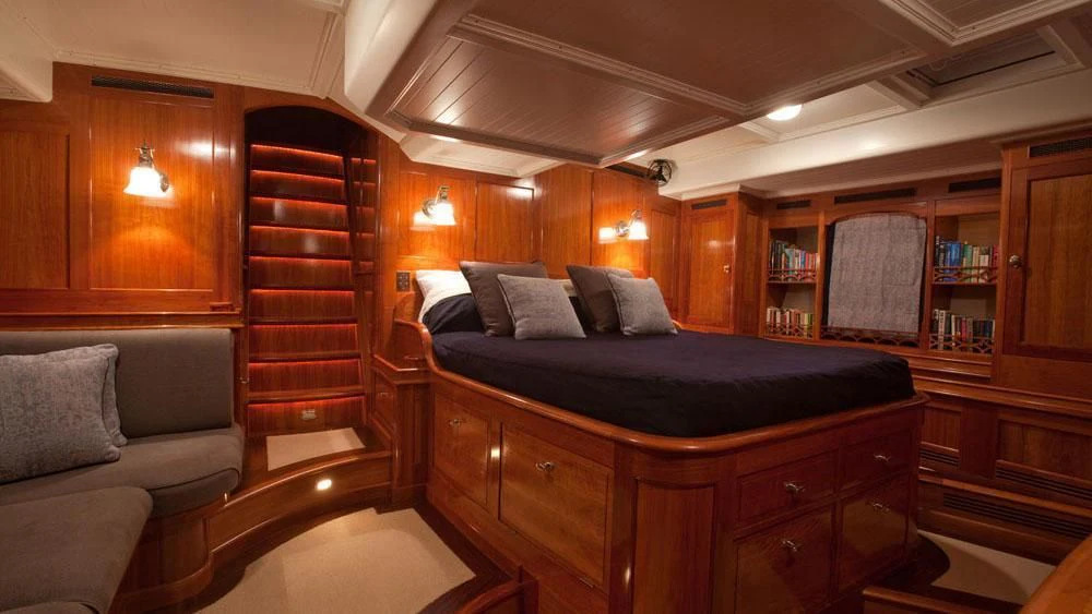 a bed in a room aboard URIEL Yacht for Sale
