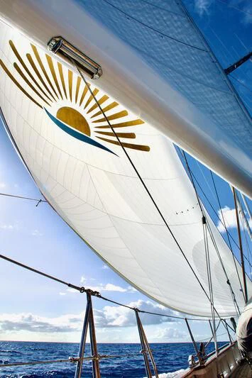 a large sailboat with a large sail aboard URIEL Yacht for Sale