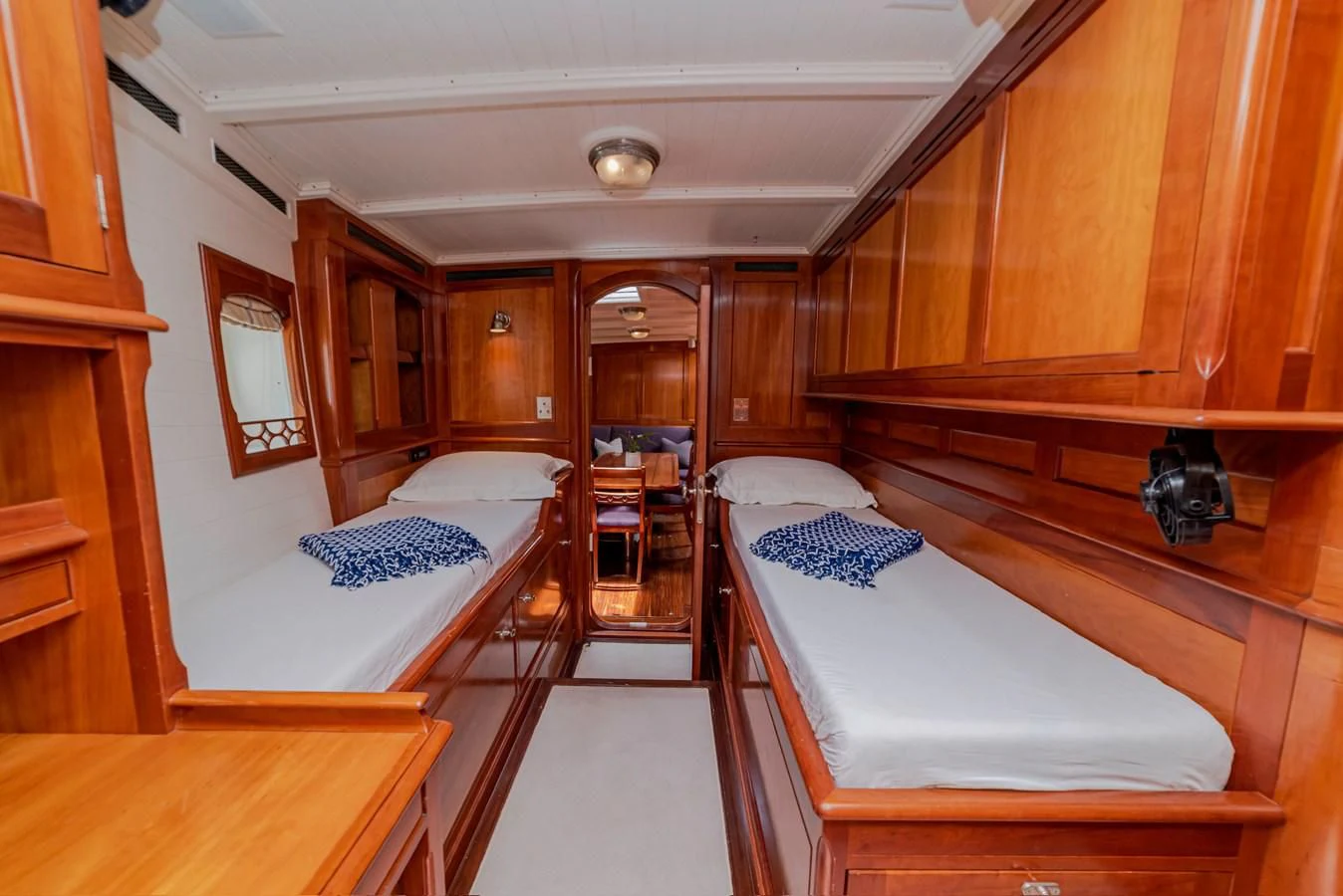 a room with wooden furniture aboard URIEL Yacht for Sale