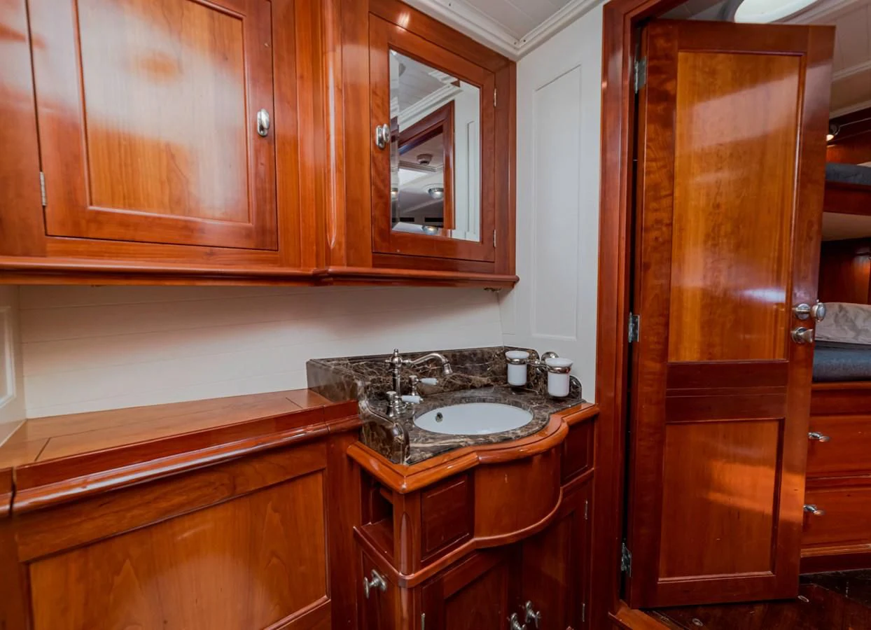 a sink and cabinets in a kitchen aboard URIEL Yacht for Sale