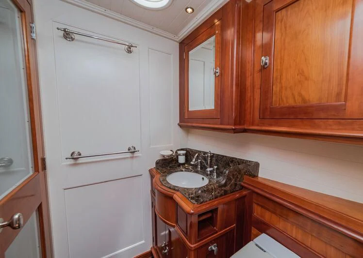 a sink and a cupboard in a kitchen aboard URIEL Yacht for Sale