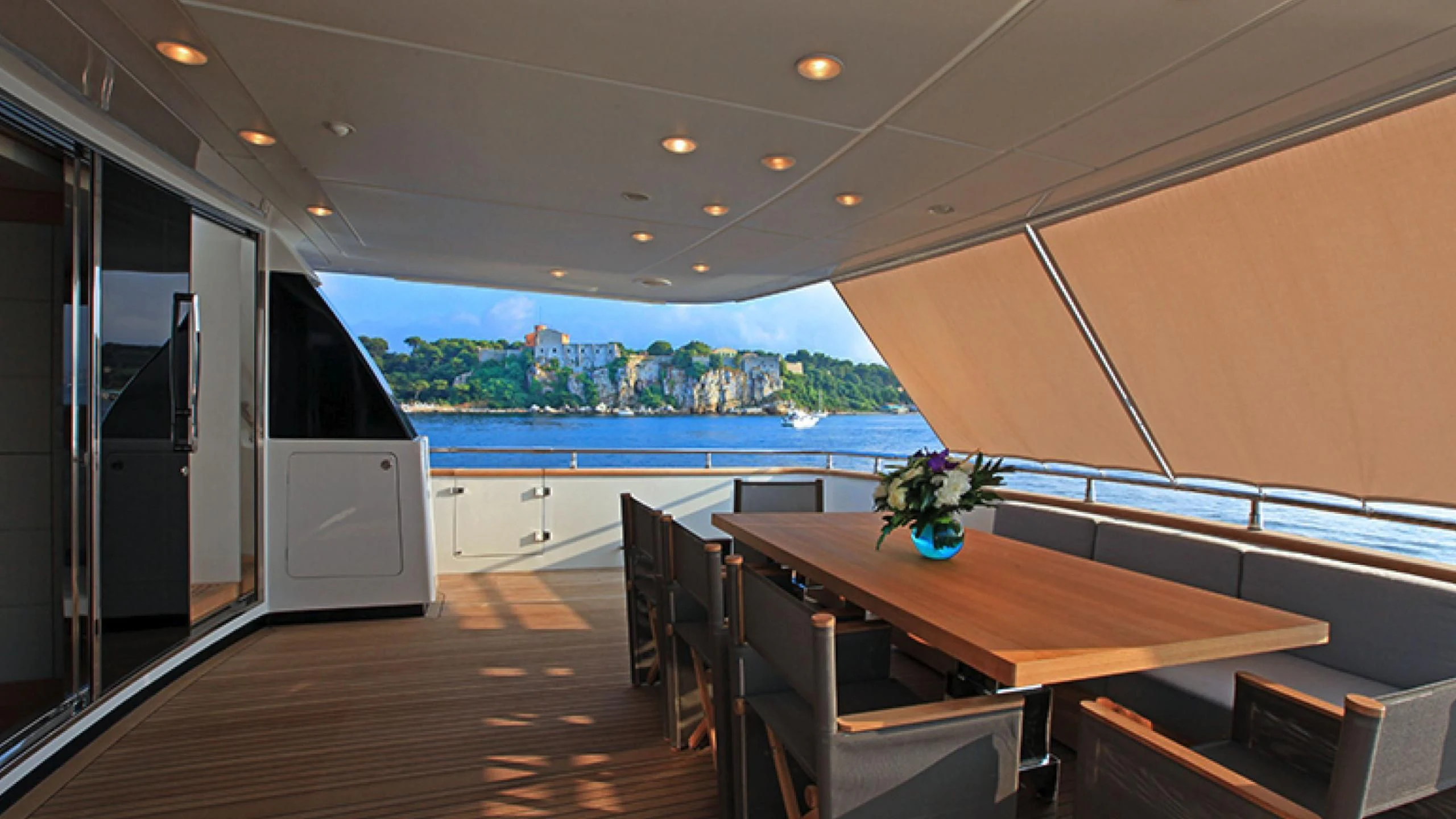 a room with a table and chairs aboard PERTULA Yacht for Sale