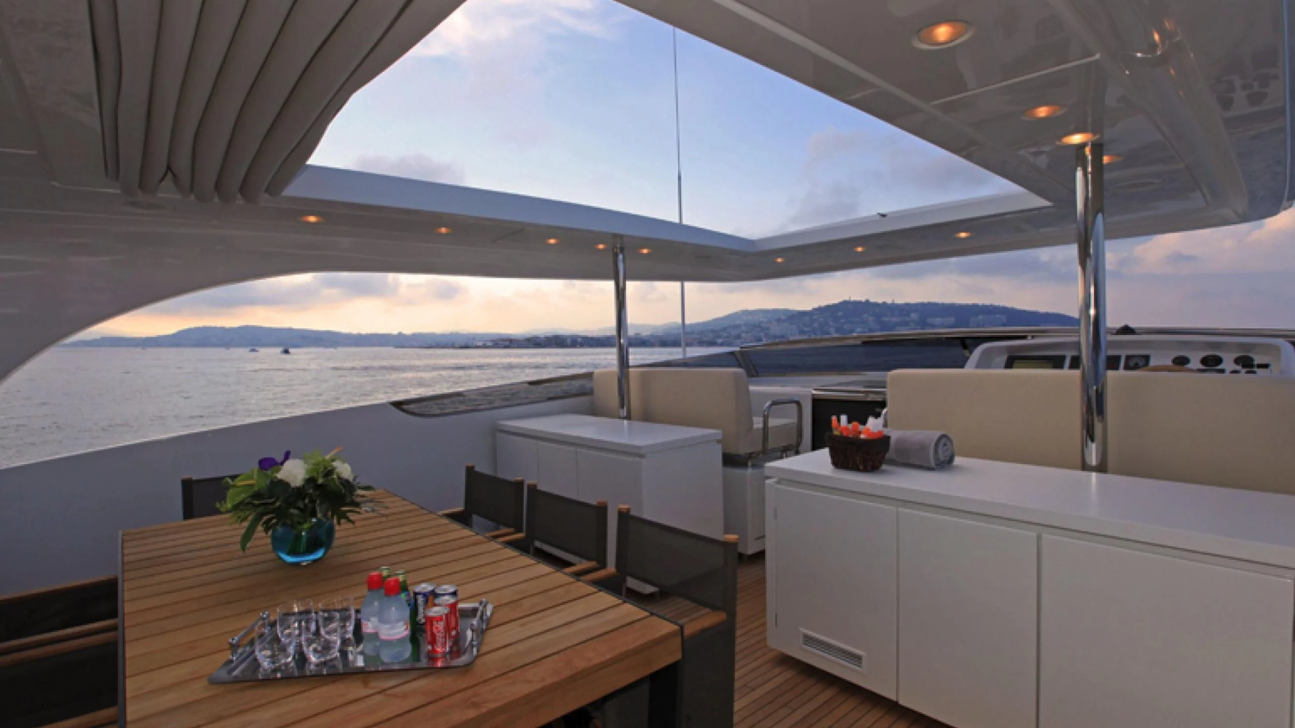 a room with a table and chairs aboard PERTULA Yacht for Sale