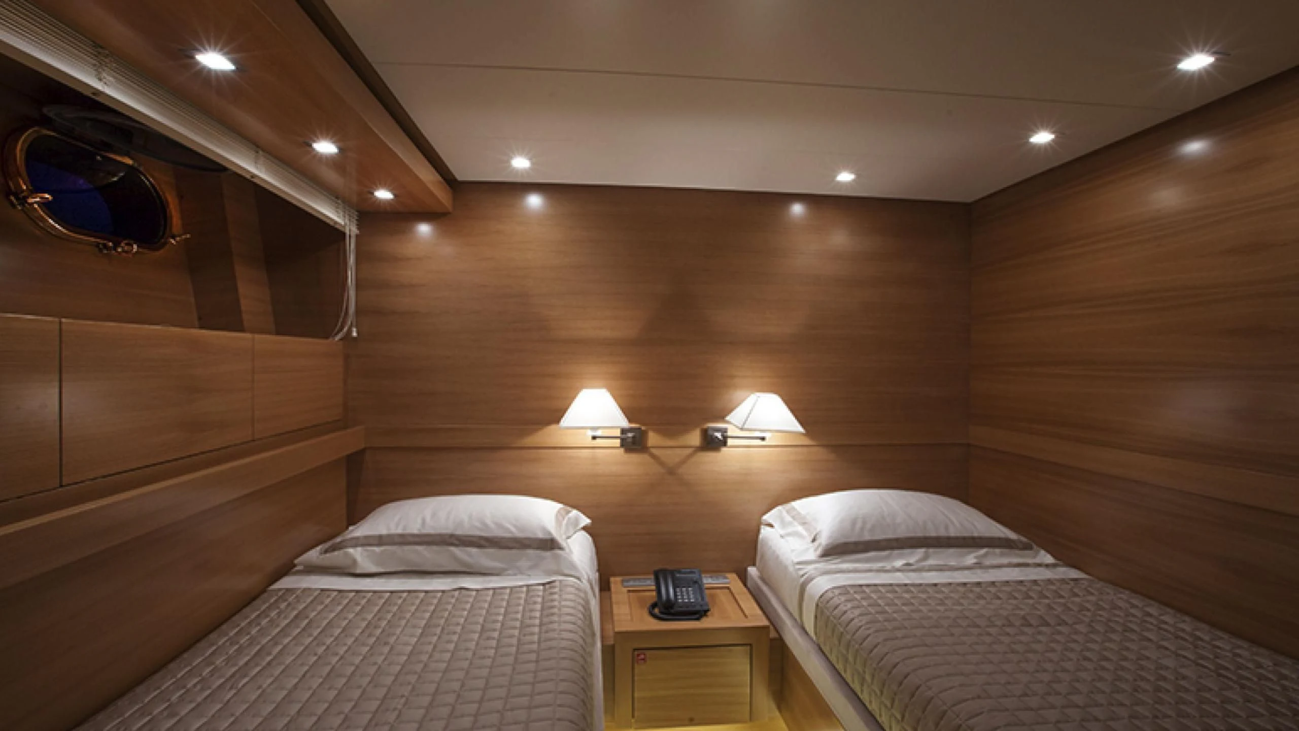 a room with two beds aboard PERTULA Yacht for Sale
