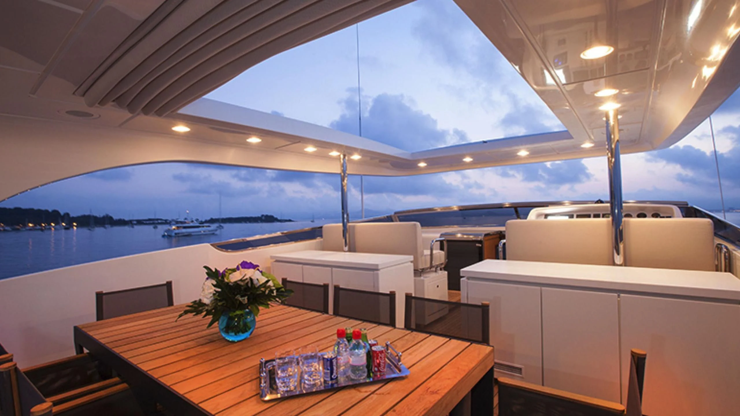 a table with a vase of flowers on it aboard PERTULA Yacht for Sale