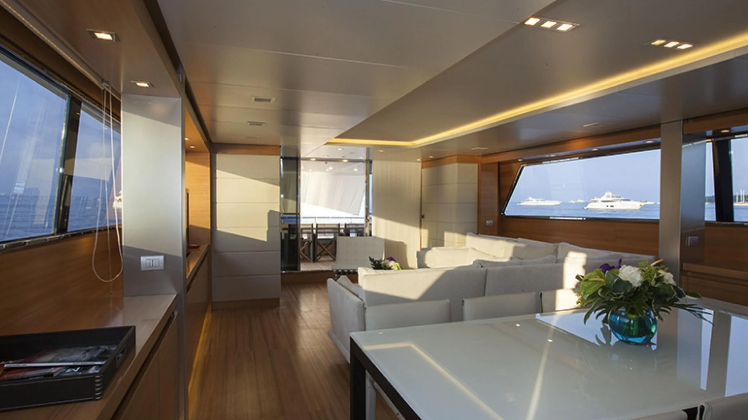 a room with a couch and a table aboard PERTULA Yacht for Sale