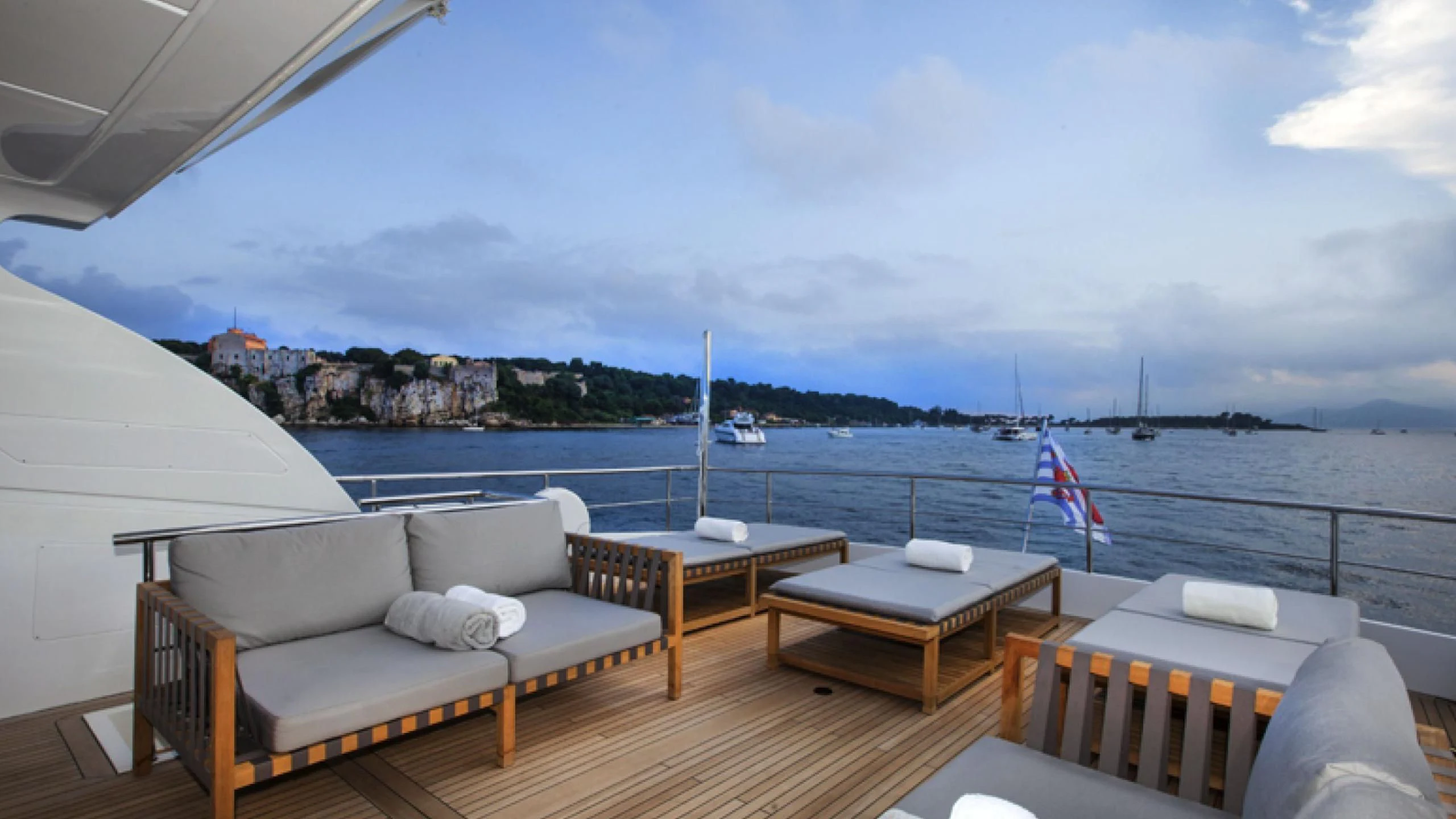 a deck overlooking a body of water aboard PERTULA Yacht for Sale