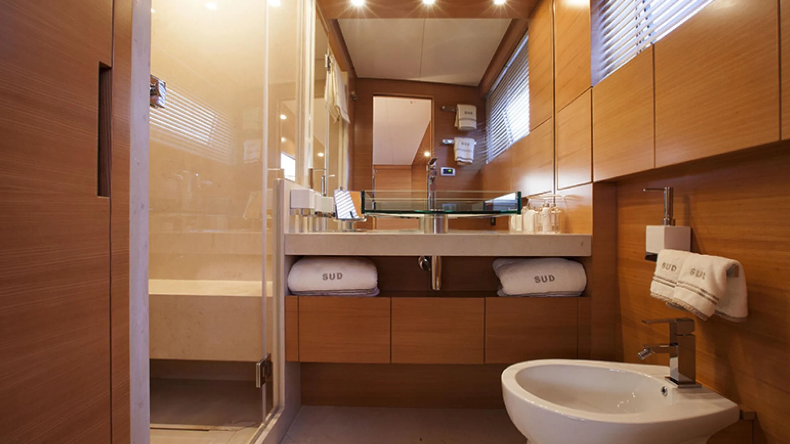 a bathroom with a sink and a mirror aboard PERTULA Yacht for Sale