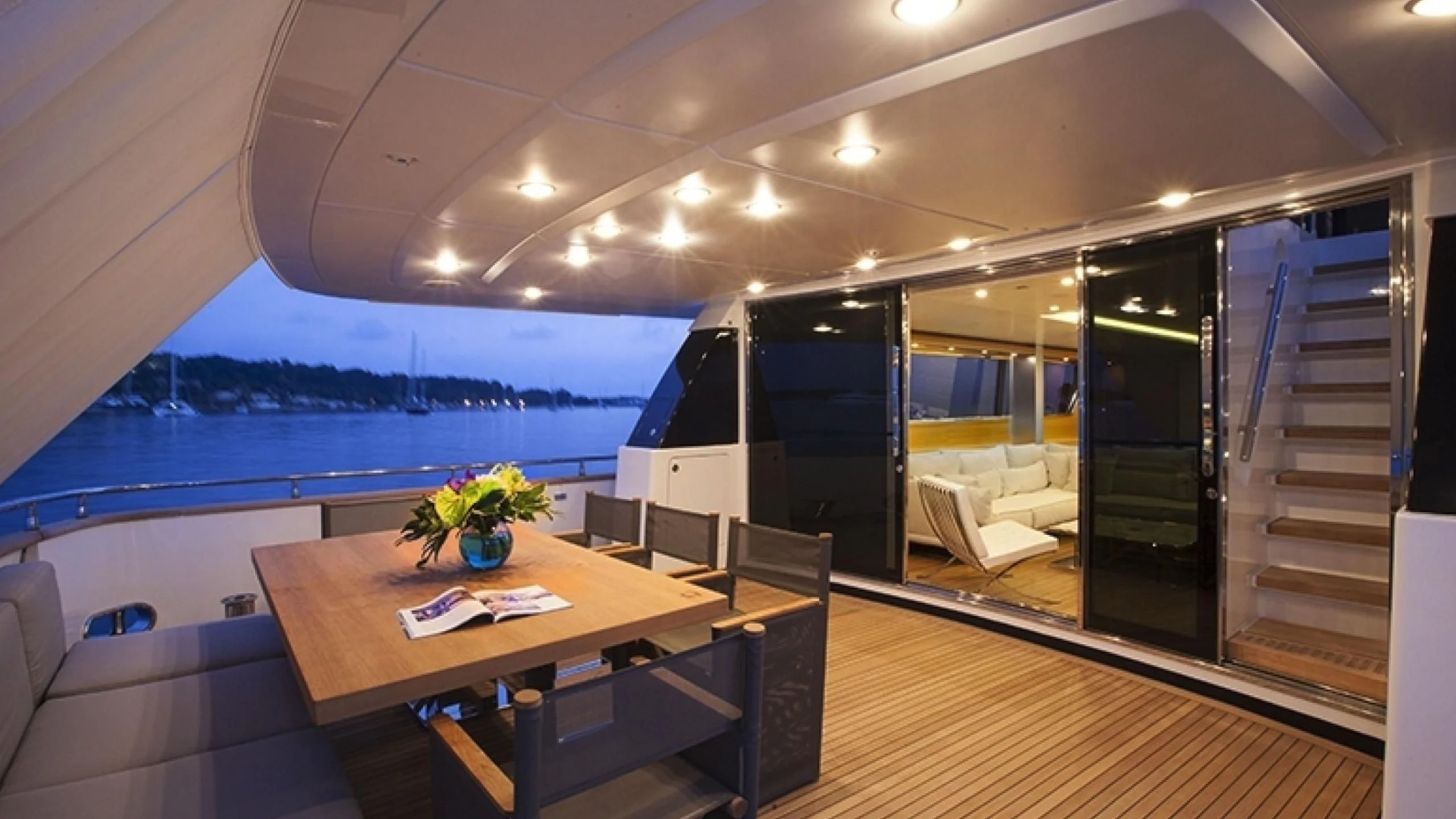 a room with a table and chairs aboard PERTULA Yacht for Sale