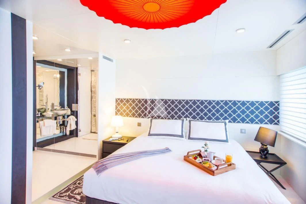 a bedroom with a large mirror aboard SALUZI Yacht for Charter