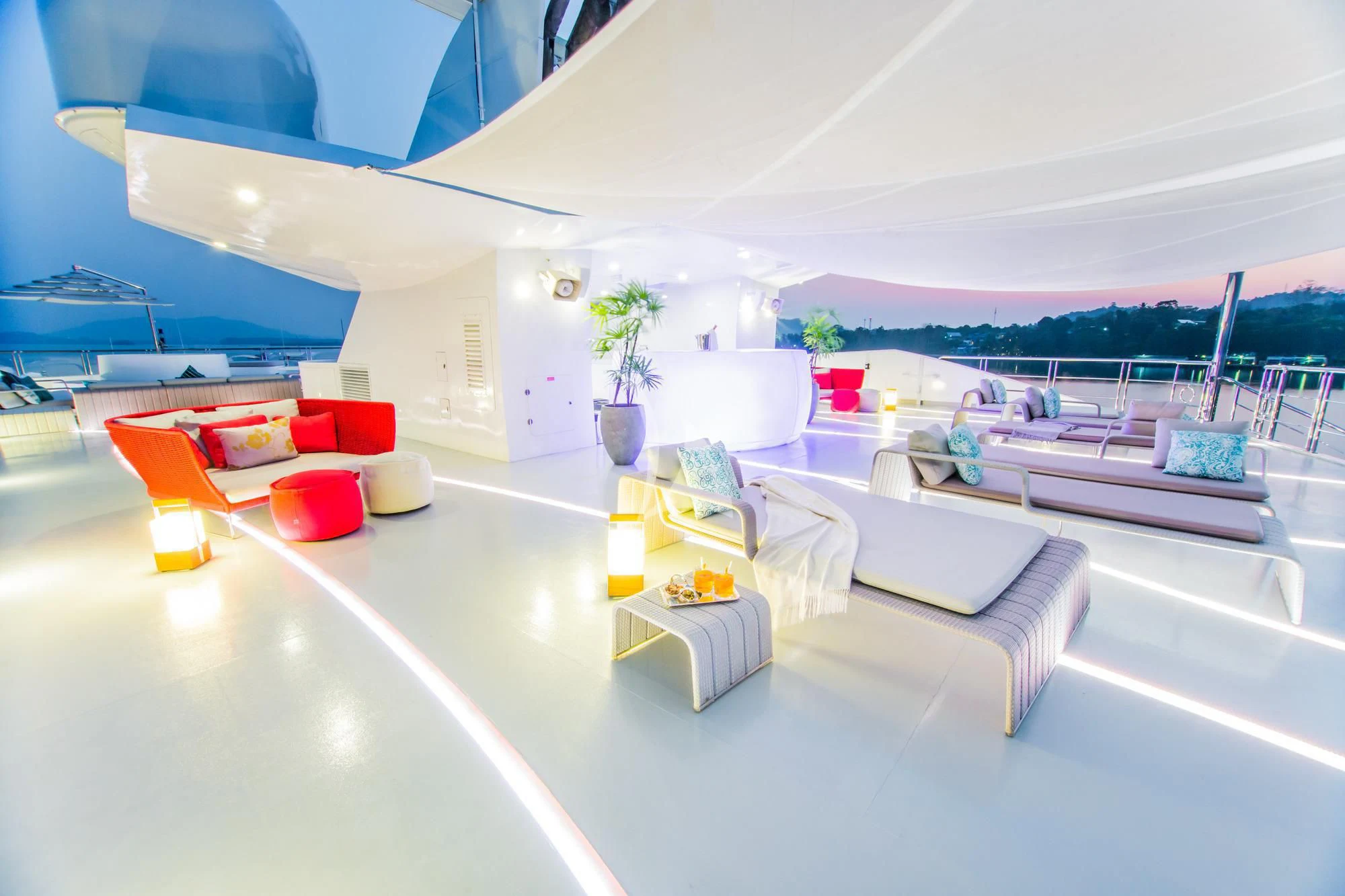 a modern living room with a large open roof aboard SALUZI Yacht for Charter