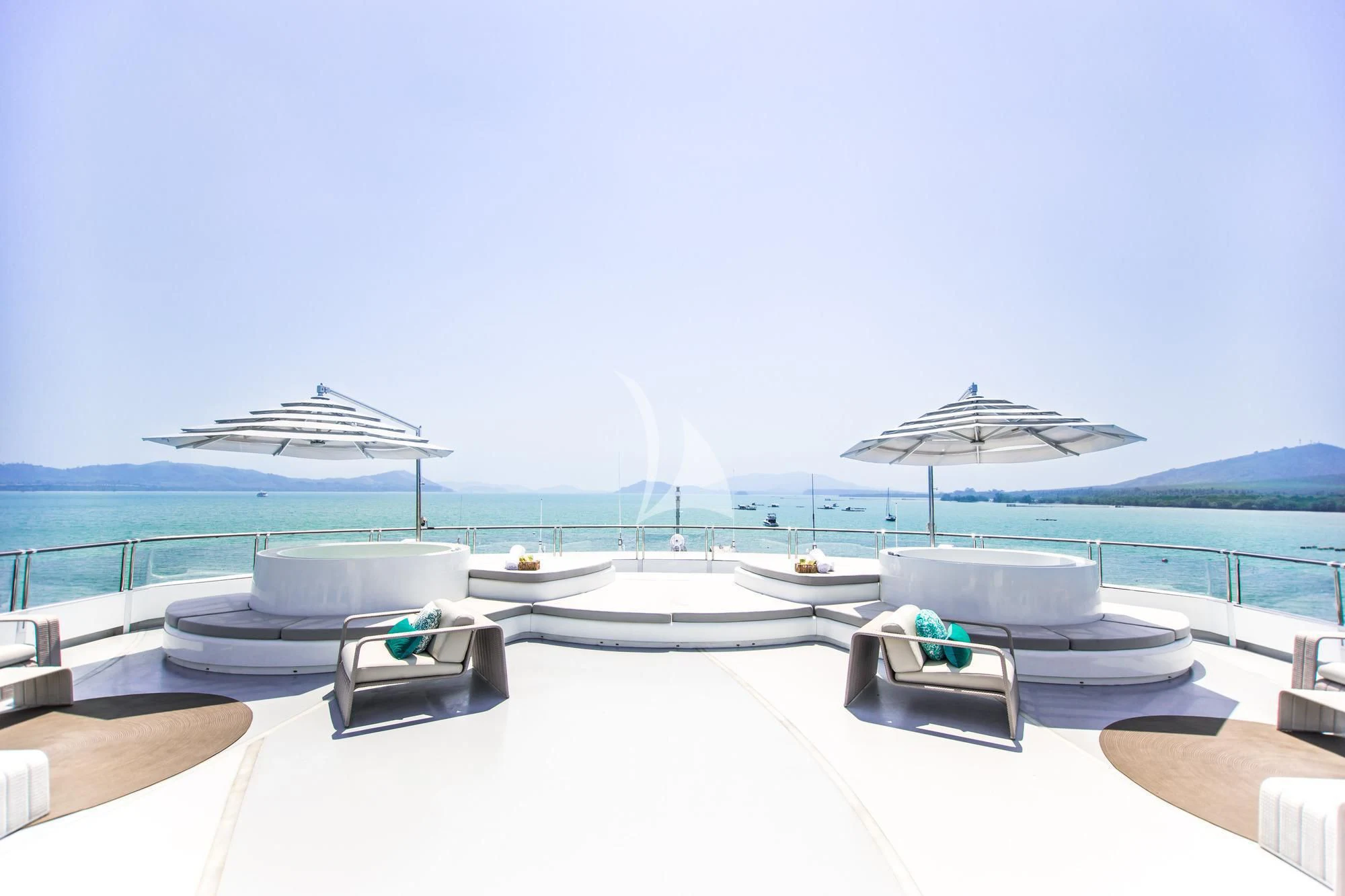 a room with a table and chairs on it by the water aboard SALUZI Yacht for Charter