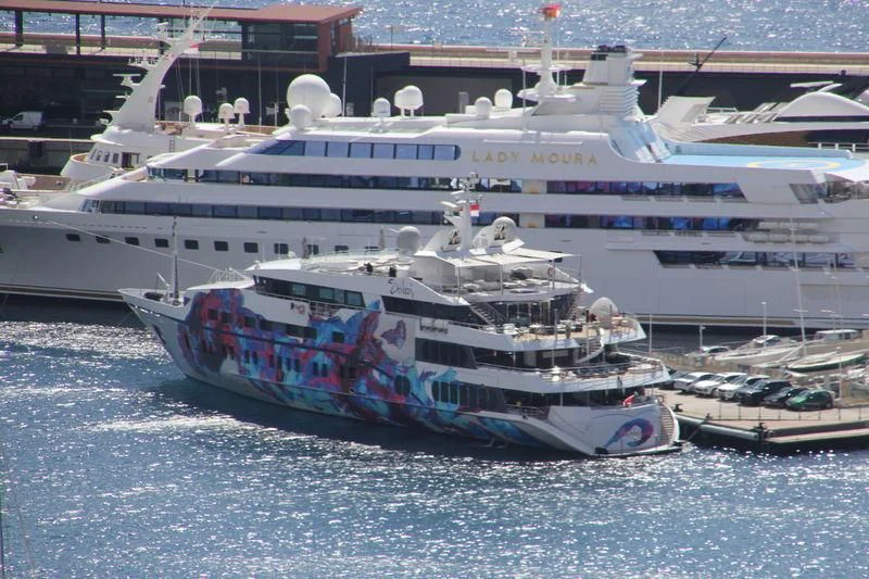 a large cruise ship docked aboard SALUZI Yacht for Charter