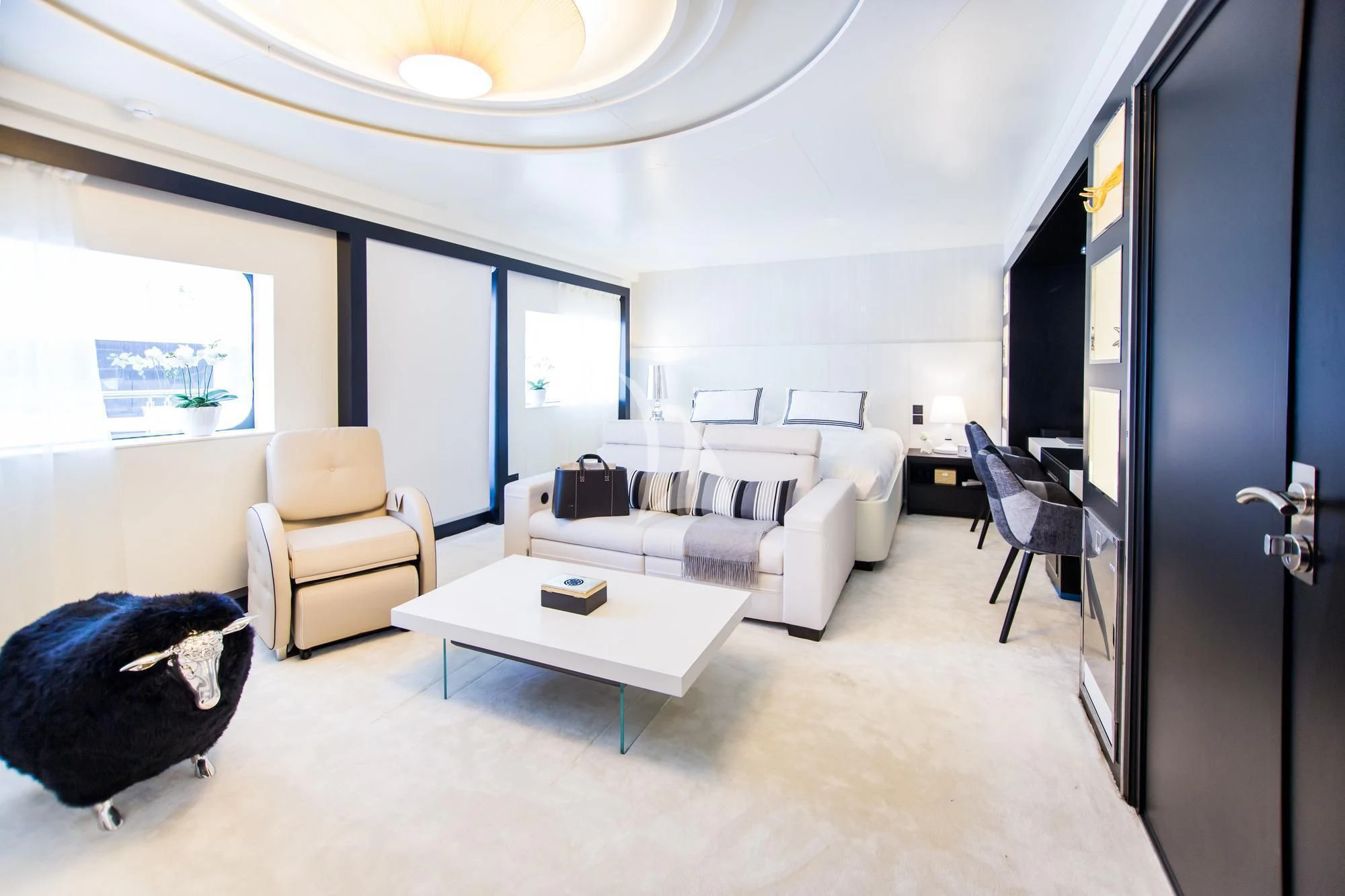 a living room with a couch and a coffee table aboard SALUZI Yacht for Charter