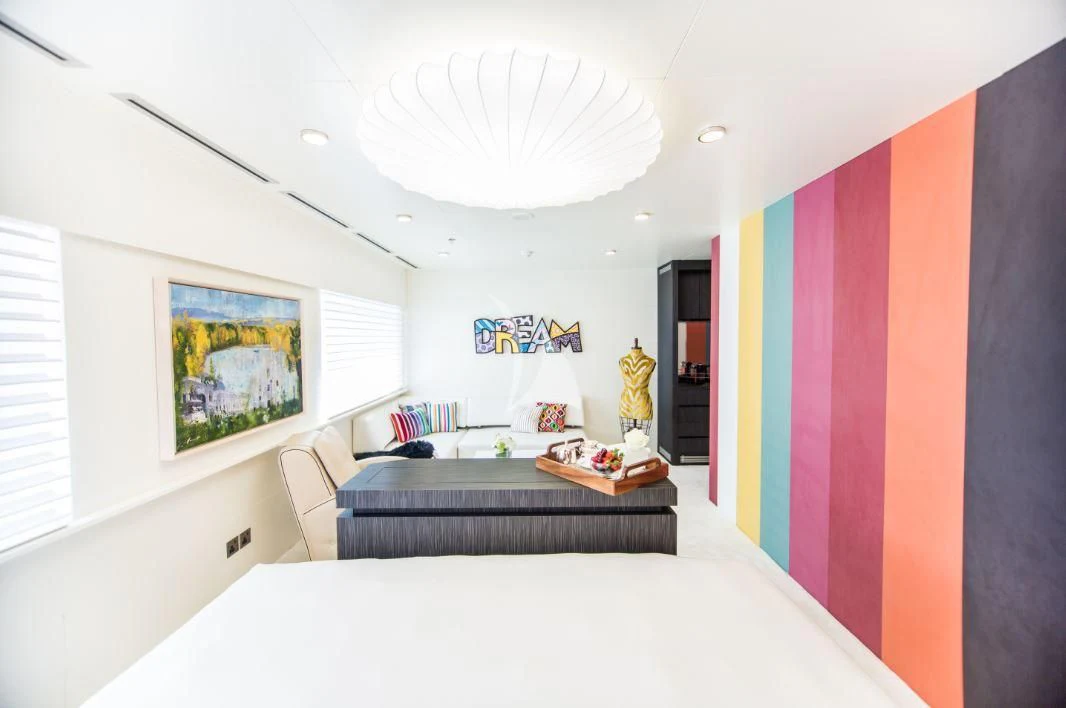 a room with a bed and a table aboard SALUZI Yacht for Charter