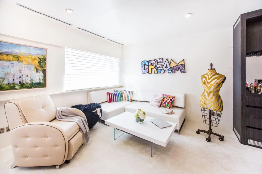 a living room with a couch and a coffee table aboard SALUZI Yacht for Charter