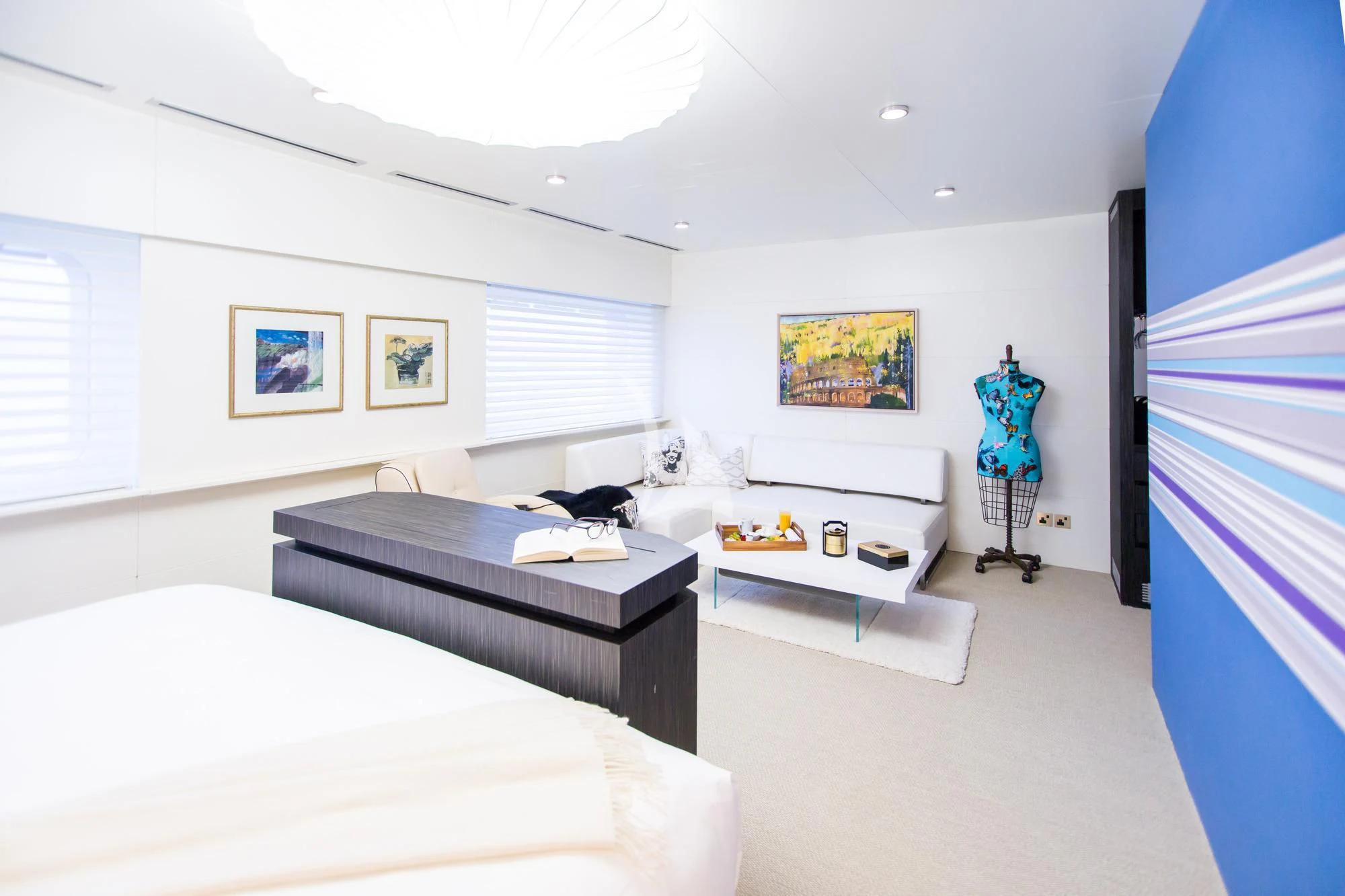 a bedroom with a bed and a desk aboard SALUZI Yacht for Charter