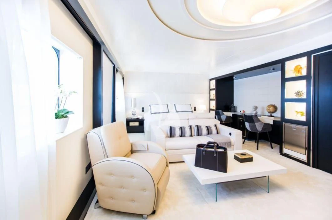 a living room with a white couch and a coffee table aboard SALUZI Yacht for Charter