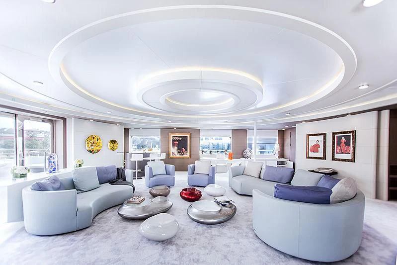 a large living room with white furniture aboard SALUZI Yacht for Charter