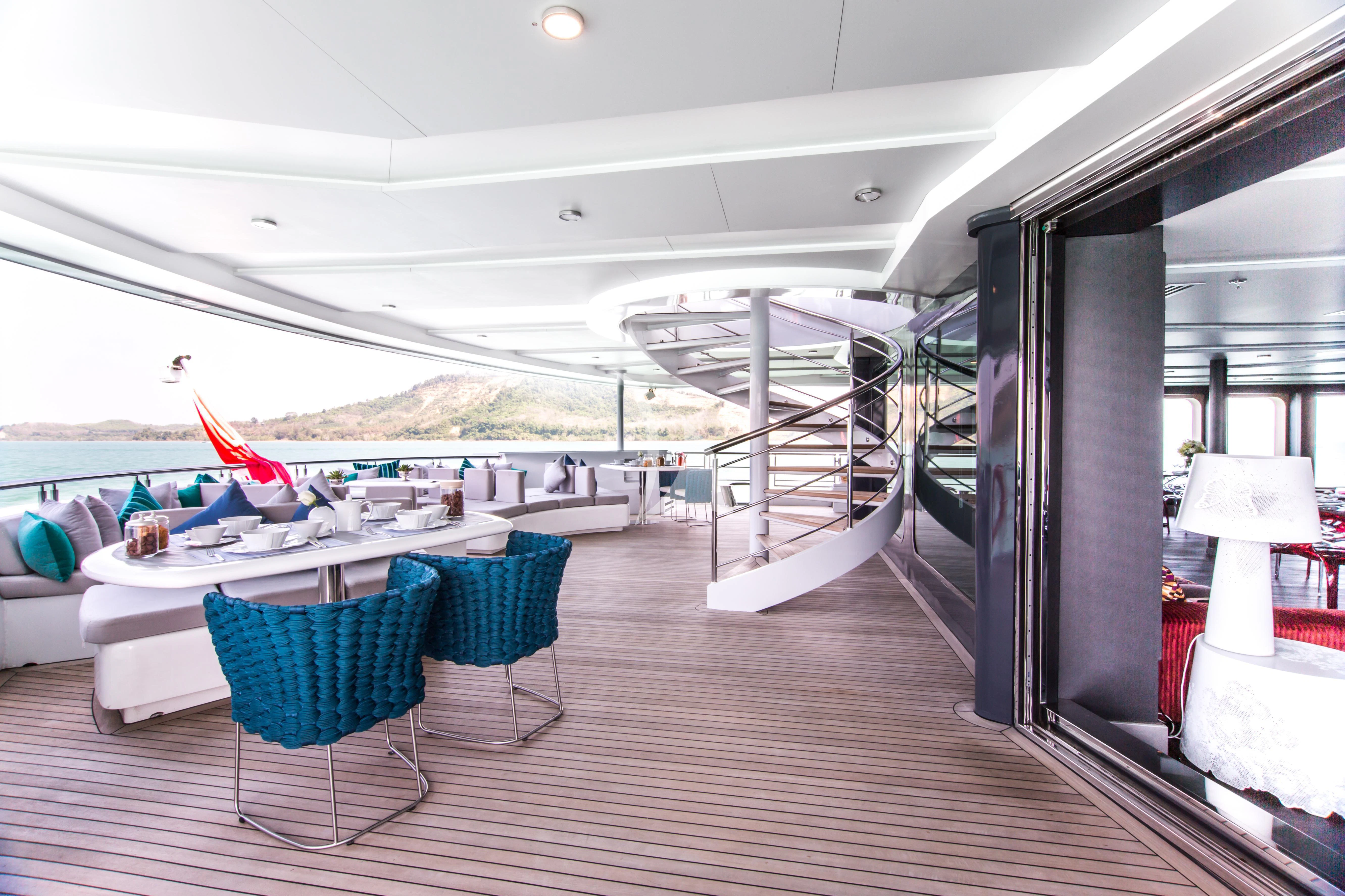 a room with a table and chairs aboard SALUZI Yacht for Charter