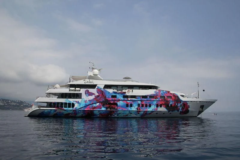 a boat with colorful flags on it aboard SALUZI Yacht for Charter
