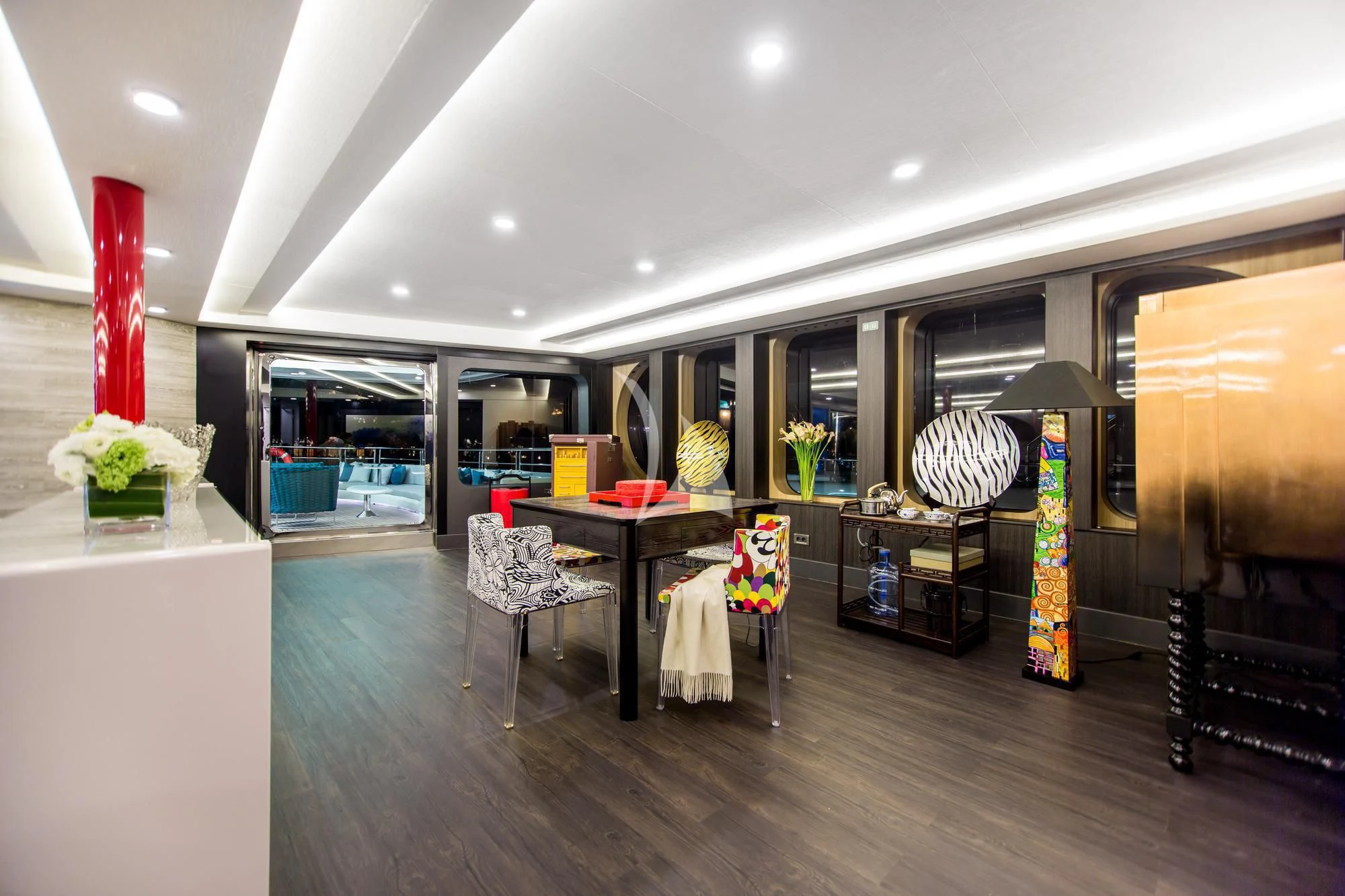 a large room with a table and chairs aboard SALUZI Yacht for Charter