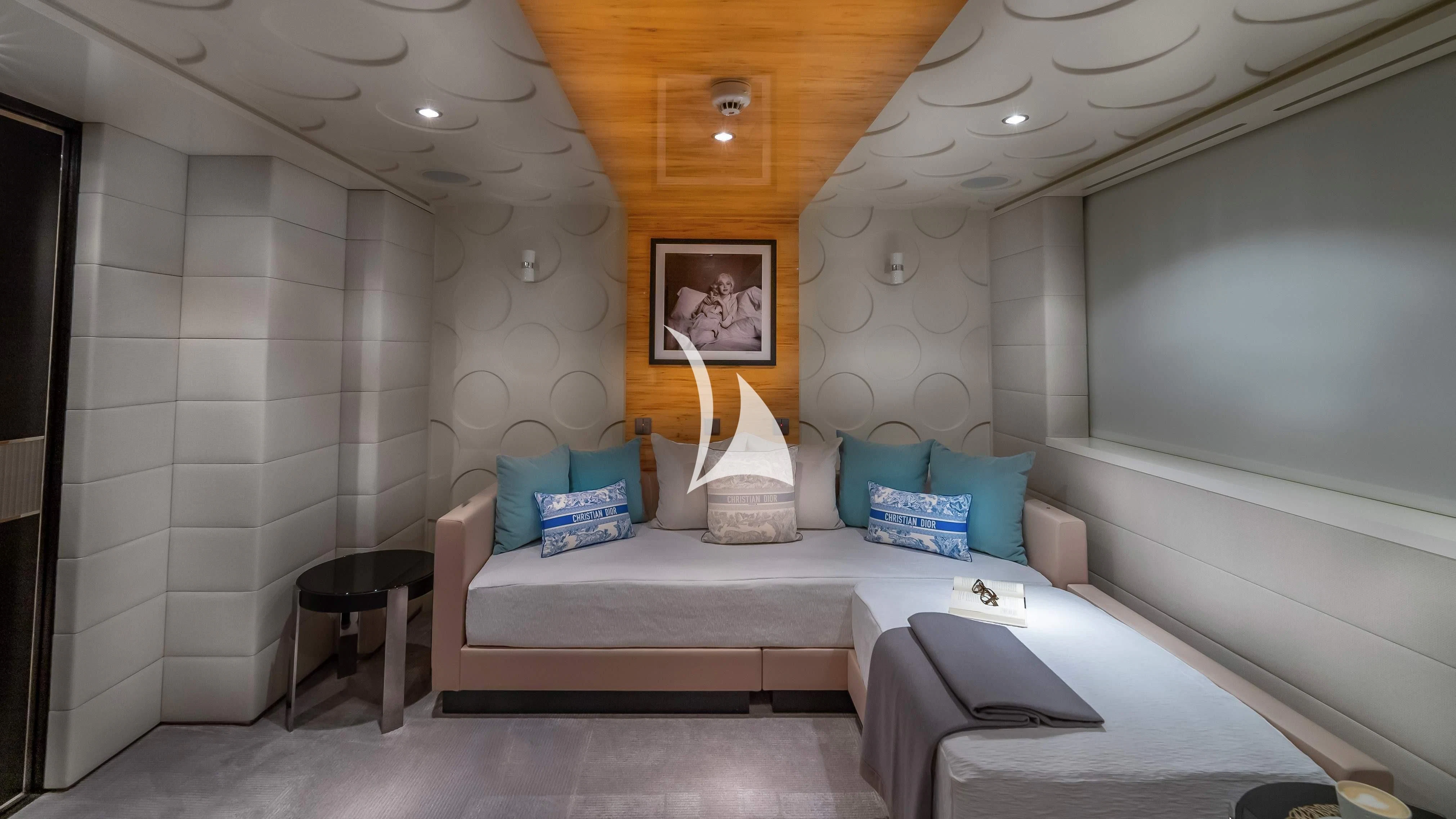 a room with a bed and a painting on the wall aboard SCOTT FREE Yacht for Charter