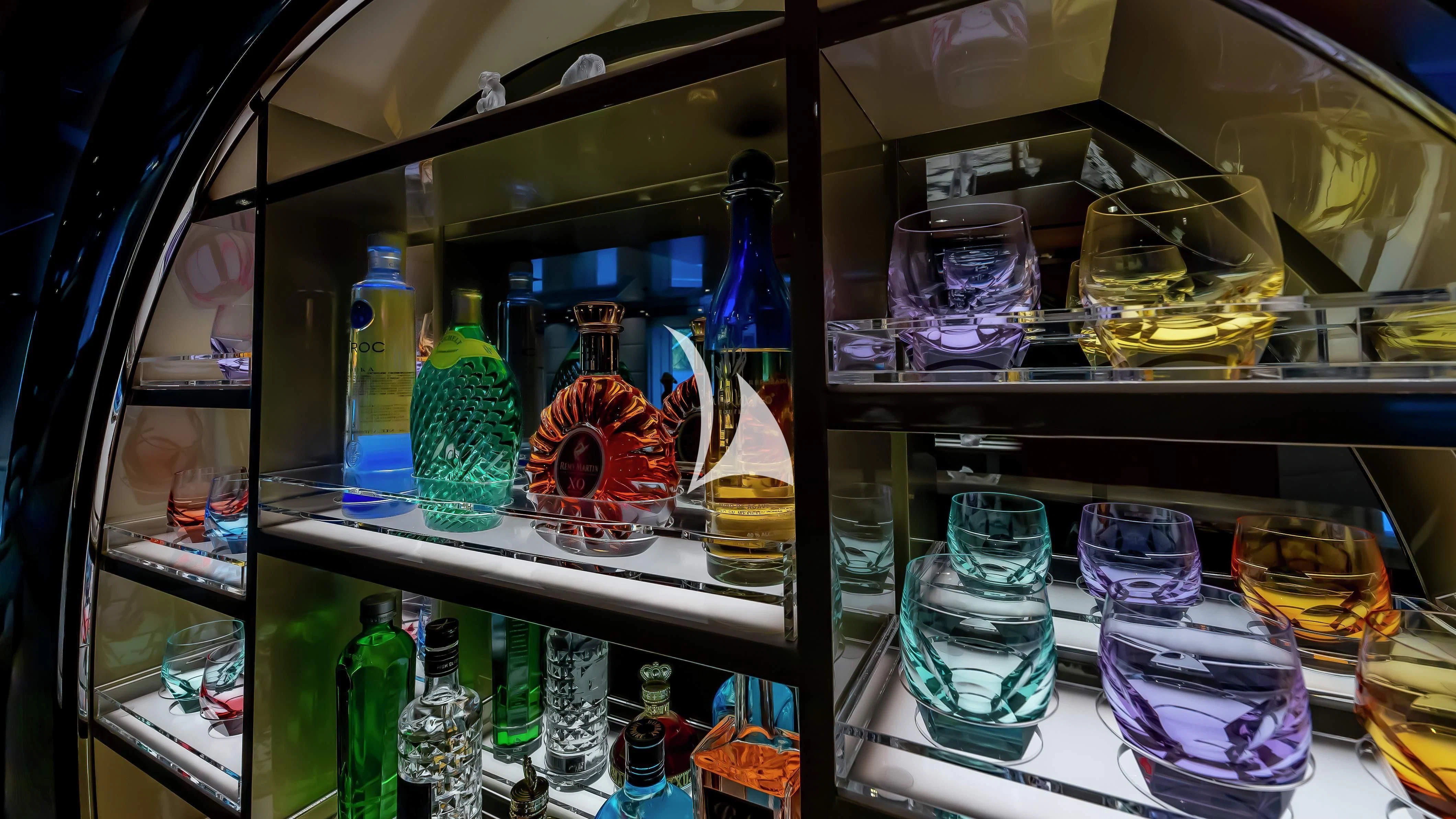 a shelf with many glass jars and objects on it aboard SCOTT FREE Yacht for Charter