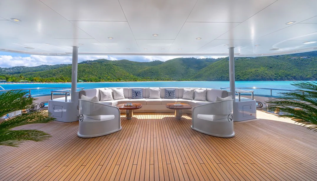 a patio with a table and chairs aboard SCOTT FREE Yacht for Charter