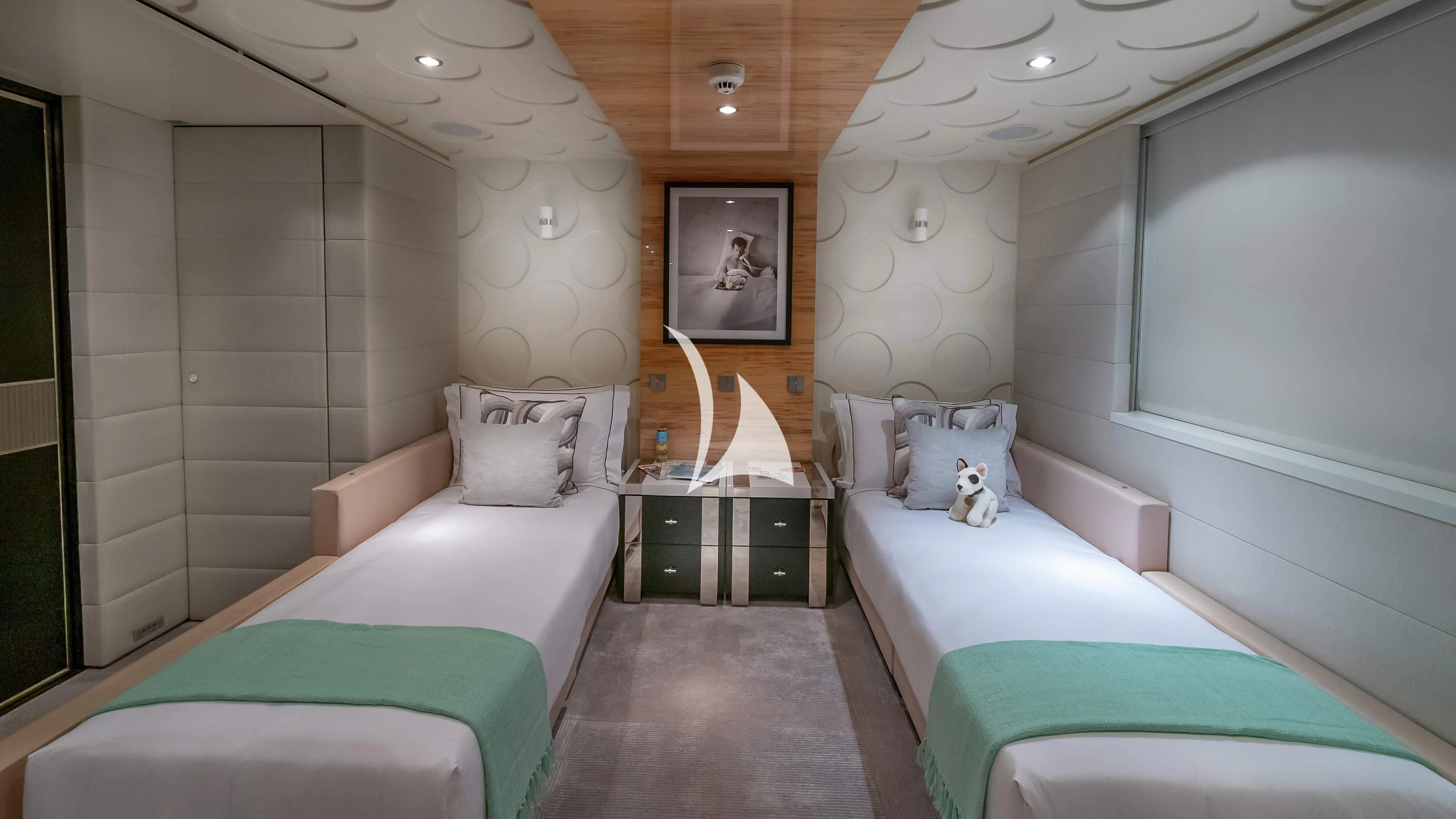 a room with a bed and a painting on the wall aboard SCOTT FREE Yacht for Charter