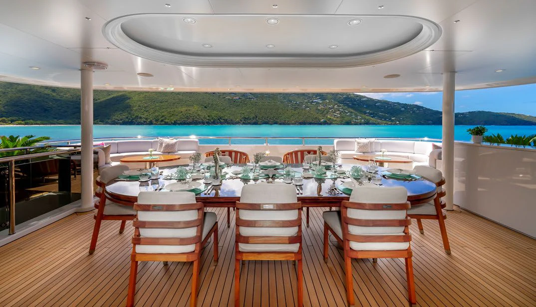 a room with a table and chairs aboard SCOTT FREE Yacht for Charter