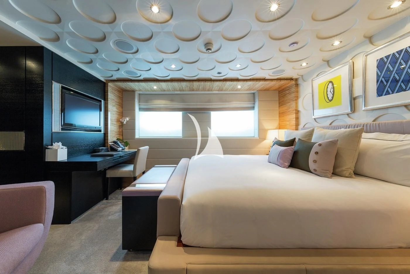 a room with a bed and a desk aboard SCOTT FREE Yacht for Charter