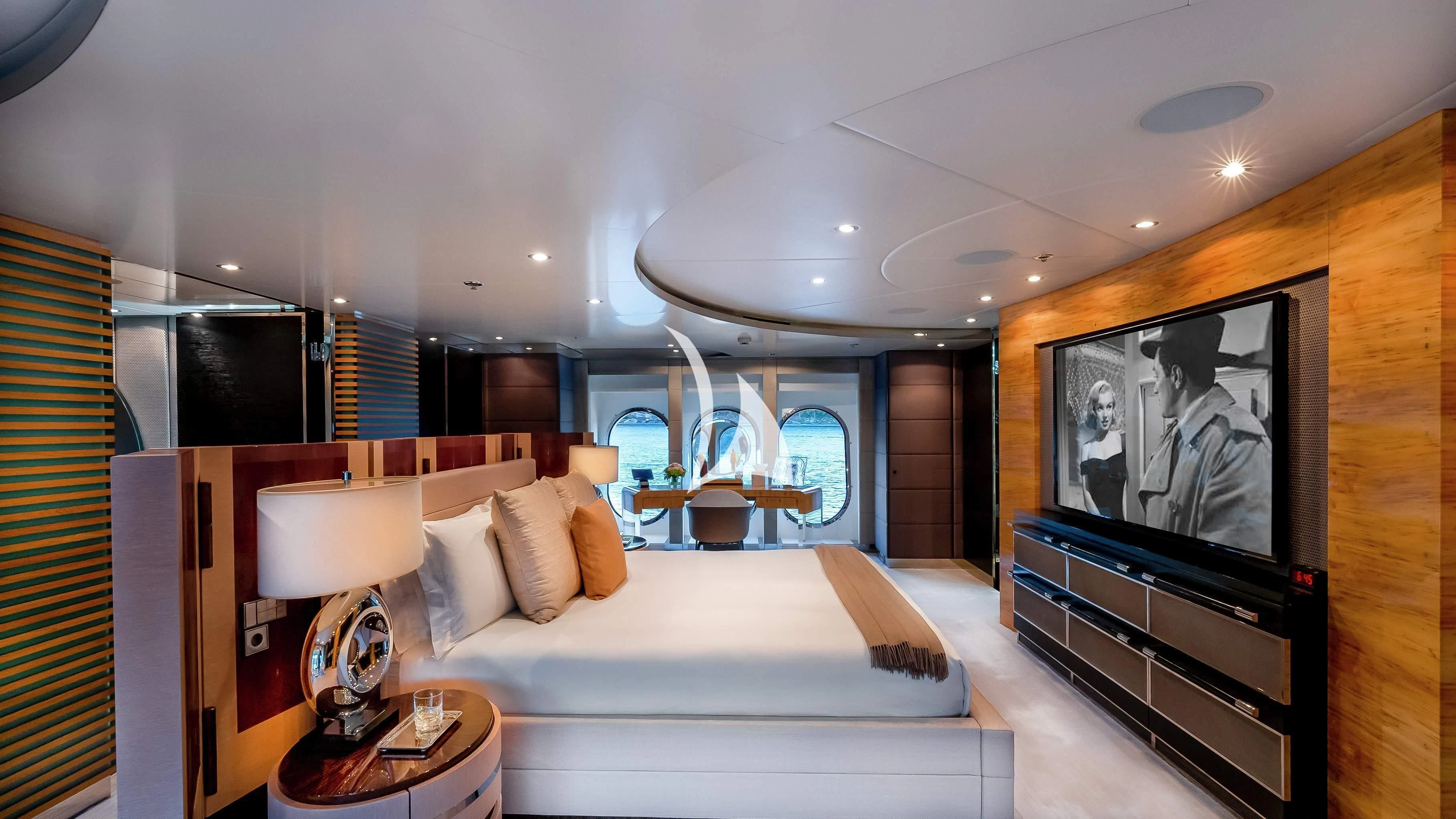 a hotel room with a large television aboard SCOTT FREE Yacht for Charter