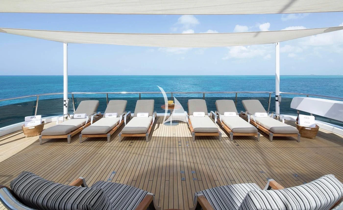 a deck with chairs and tables on it aboard SCOTT FREE Yacht for Charter