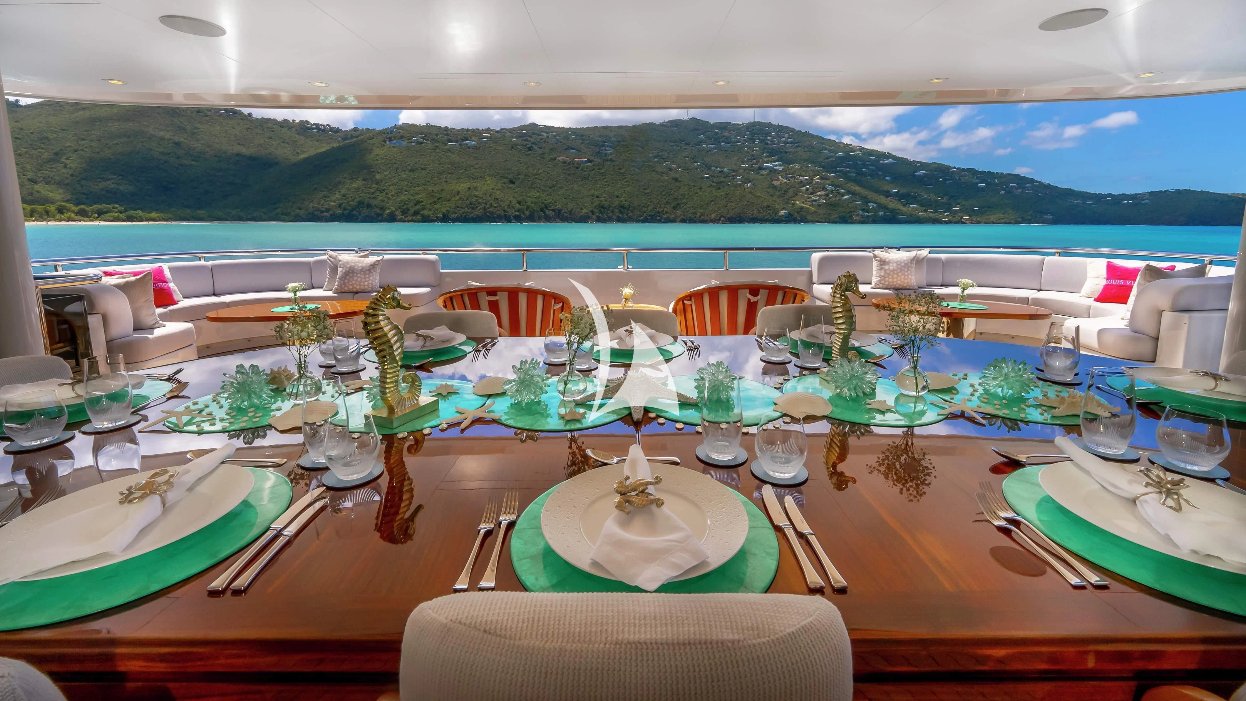 a table set for a dinner party aboard SCOTT FREE Yacht for Charter