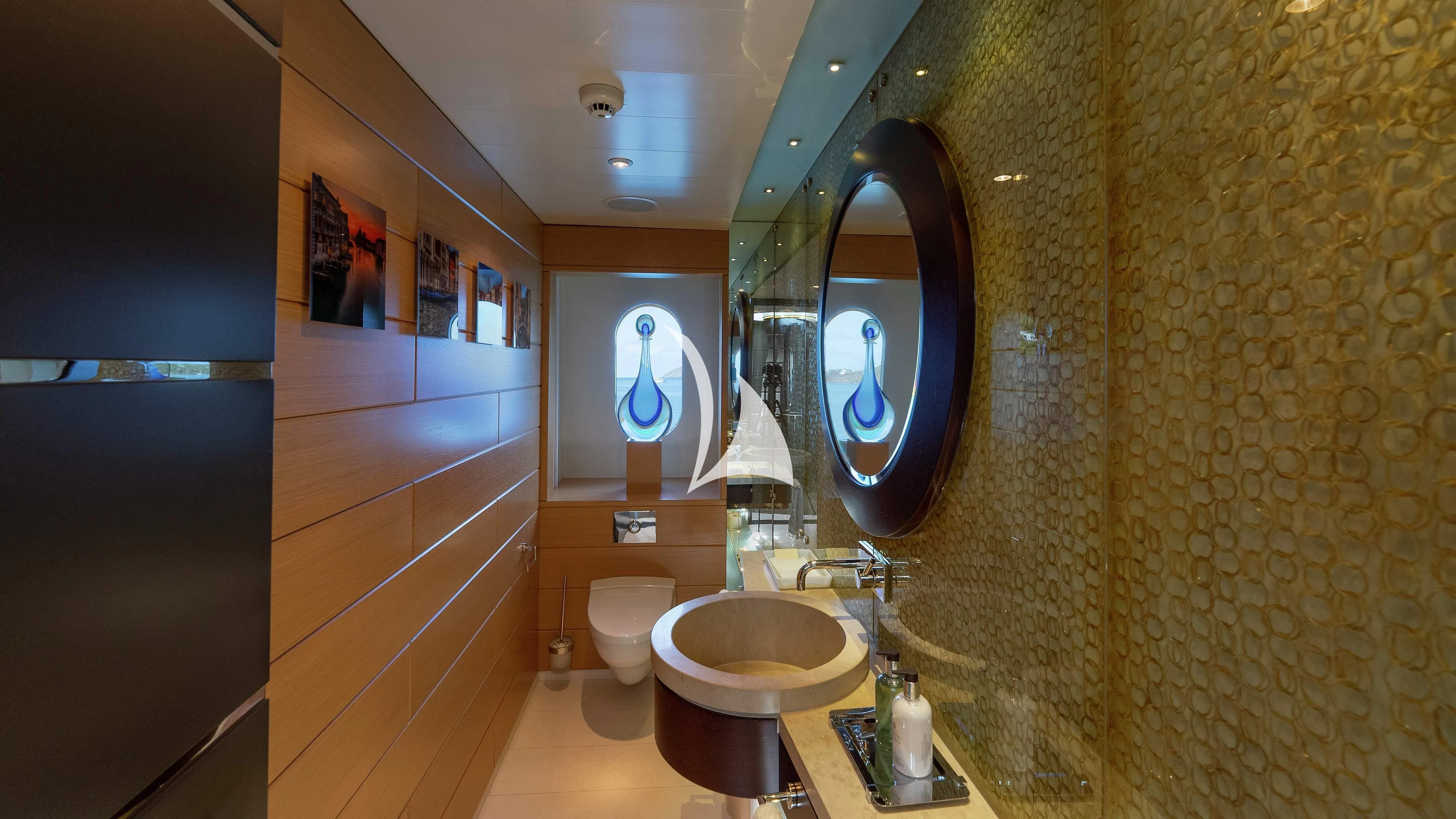 a bathroom with a large mirror aboard SCOTT FREE Yacht for Charter