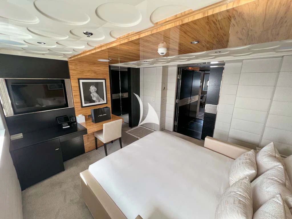 a living room with a couch and tv aboard SCOTT FREE Yacht for Charter