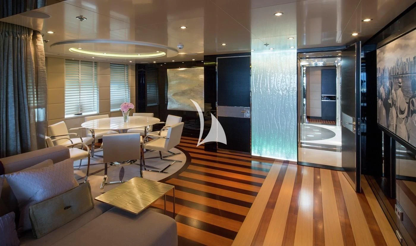 a room with a table chairs and a large window aboard SCOTT FREE Yacht for Charter