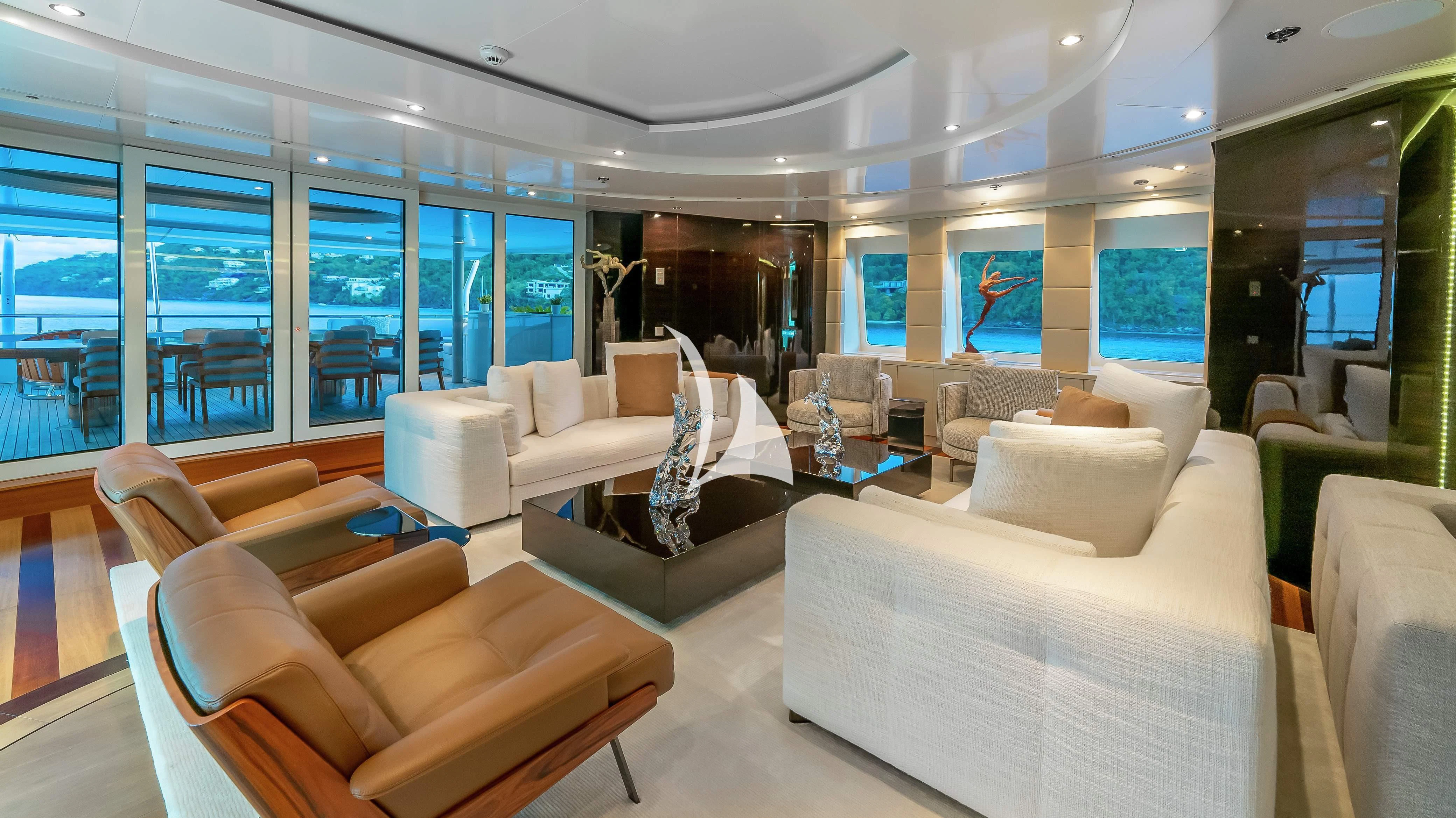 a large living room with a large window aboard SCOTT FREE Yacht for Charter