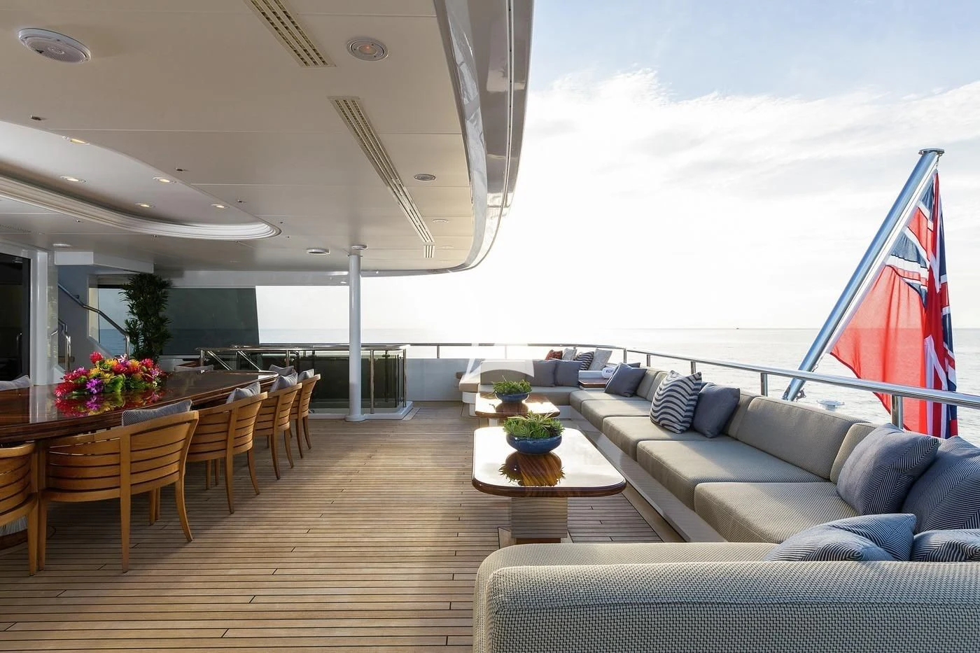 a room with a couch and a table and chairs aboard SCOTT FREE Yacht for Charter
