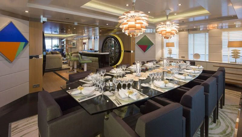 a large room with a table and chairs aboard SCOTT FREE Yacht for Charter