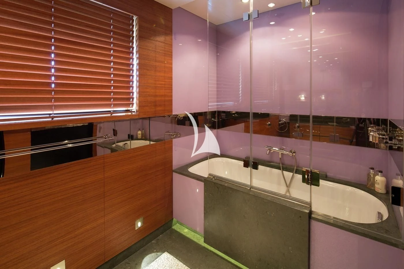 a bathroom with a tub and shower aboard SCOTT FREE Yacht for Charter