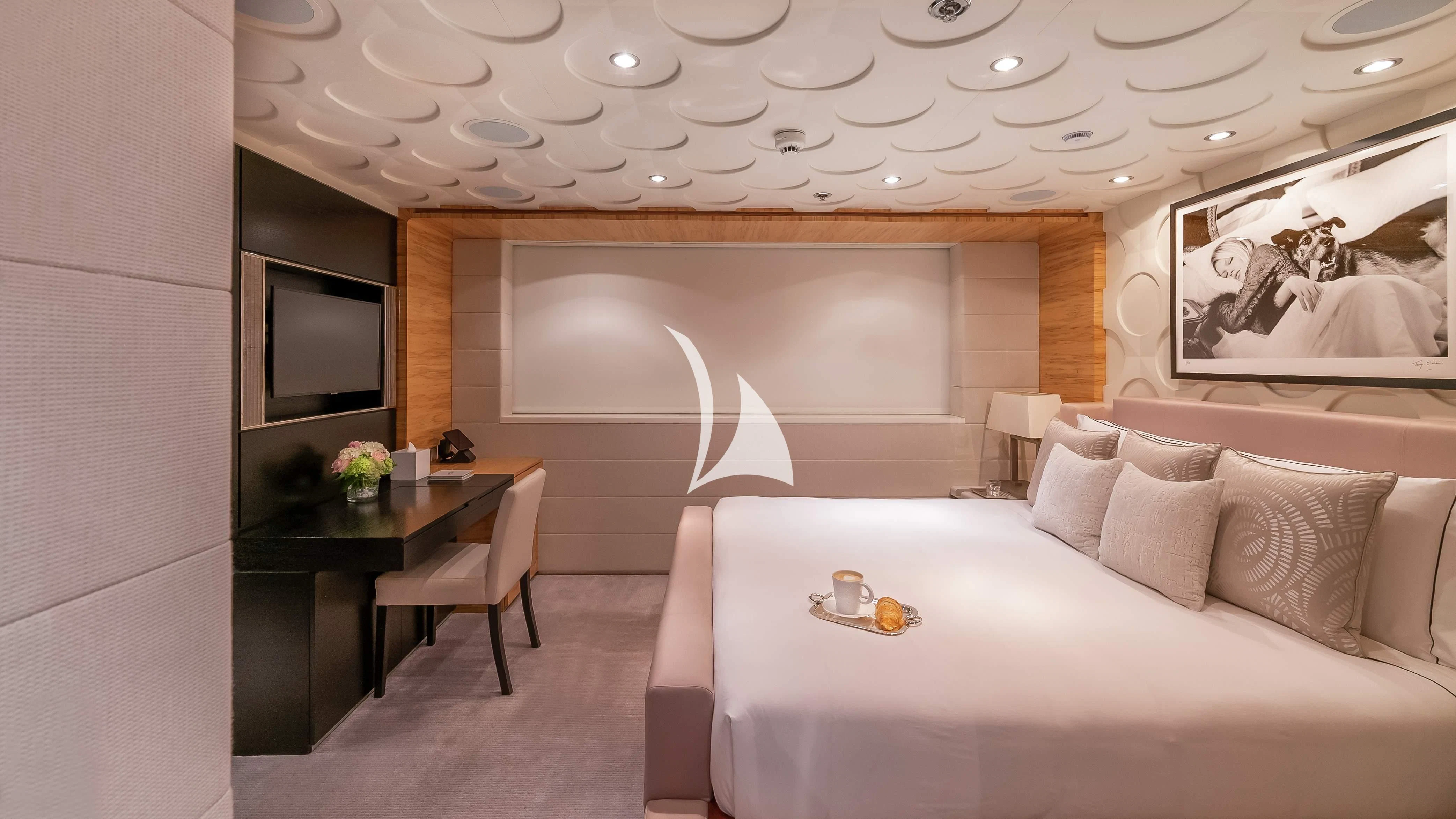 a room with a bed and a desk aboard SCOTT FREE Yacht for Charter