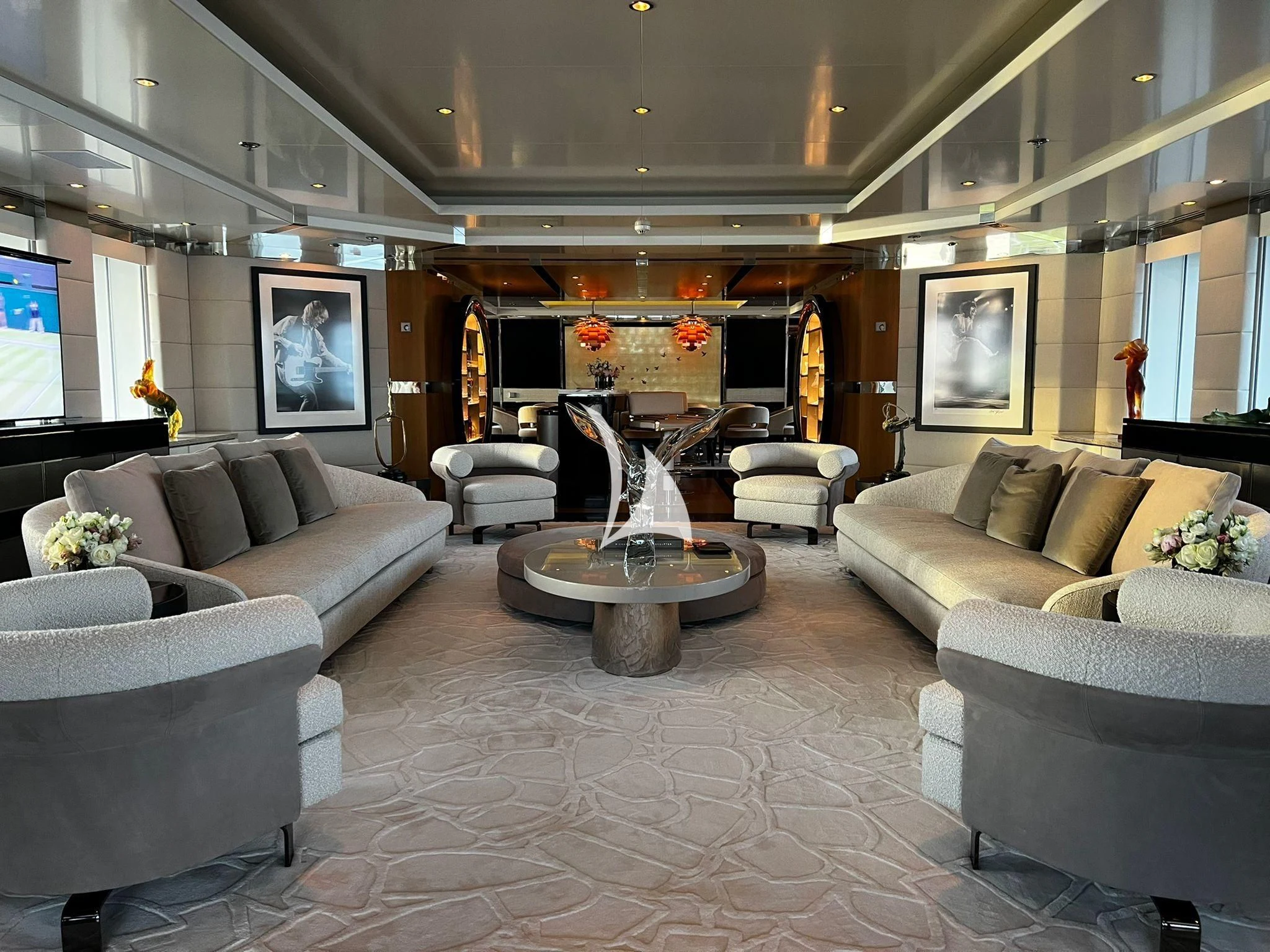 a living room with a fireplace aboard SCOTT FREE Yacht for Charter