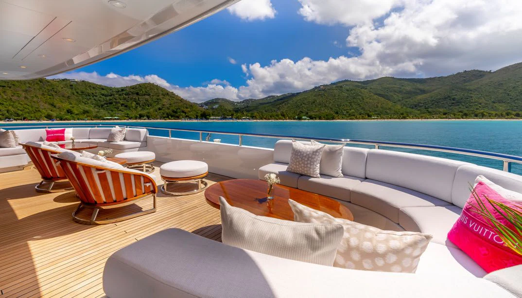 a room with a view of the ocean and mountains aboard SCOTT FREE Yacht for Charter