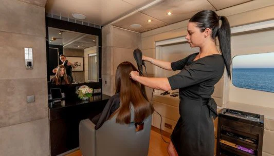 a woman holding a phone aboard SCOTT FREE Yacht for Charter