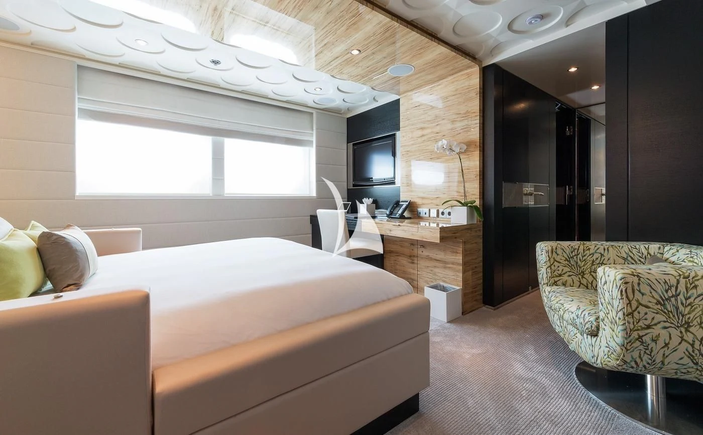 a room with a bed and a tv aboard SCOTT FREE Yacht for Charter