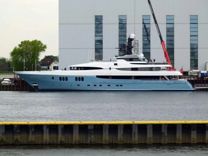 a large white boat in a harbor aboard SCOTT FREE Yacht for Charter