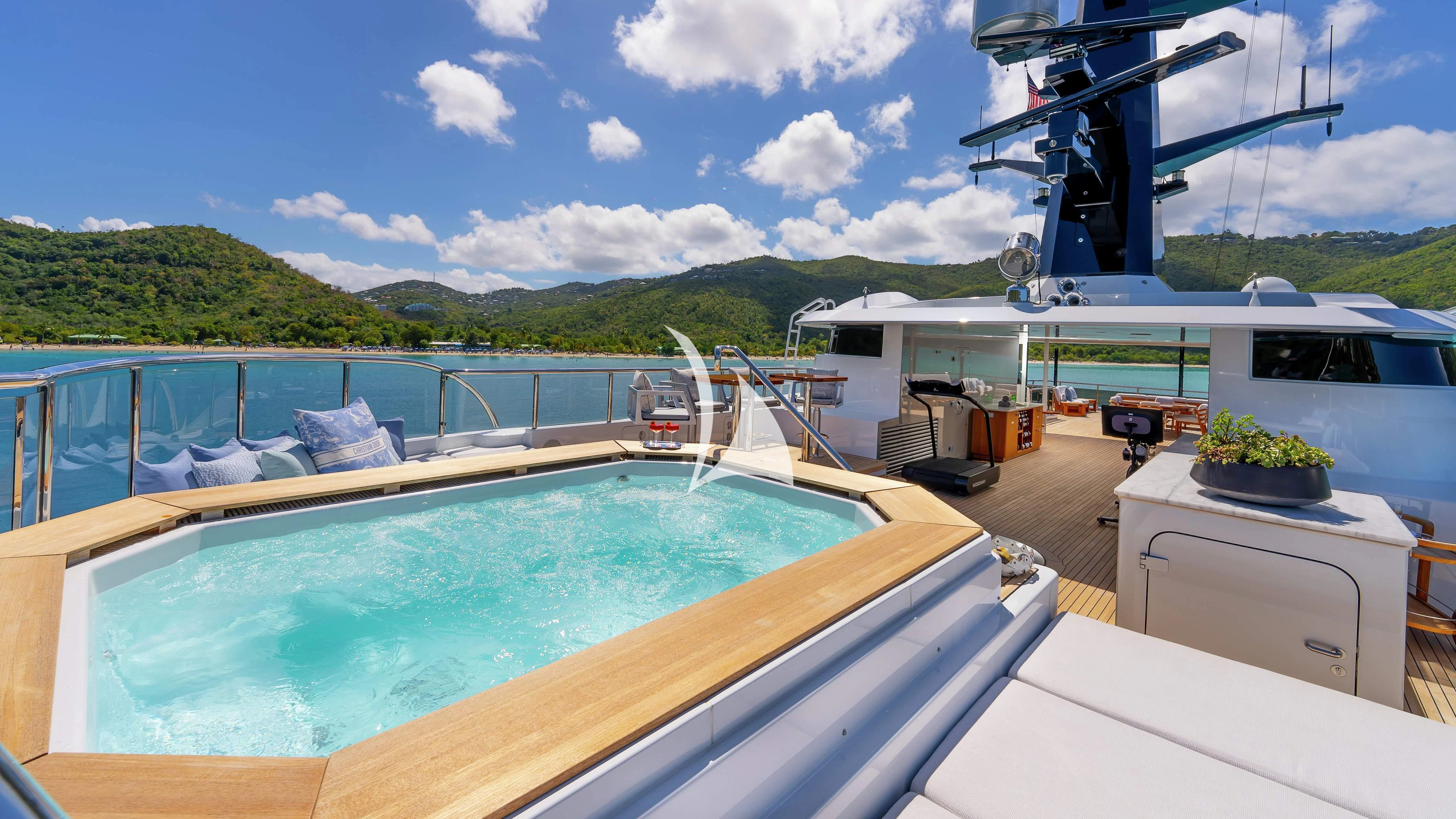 a large boat docked at a pier aboard SCOTT FREE Yacht for Charter