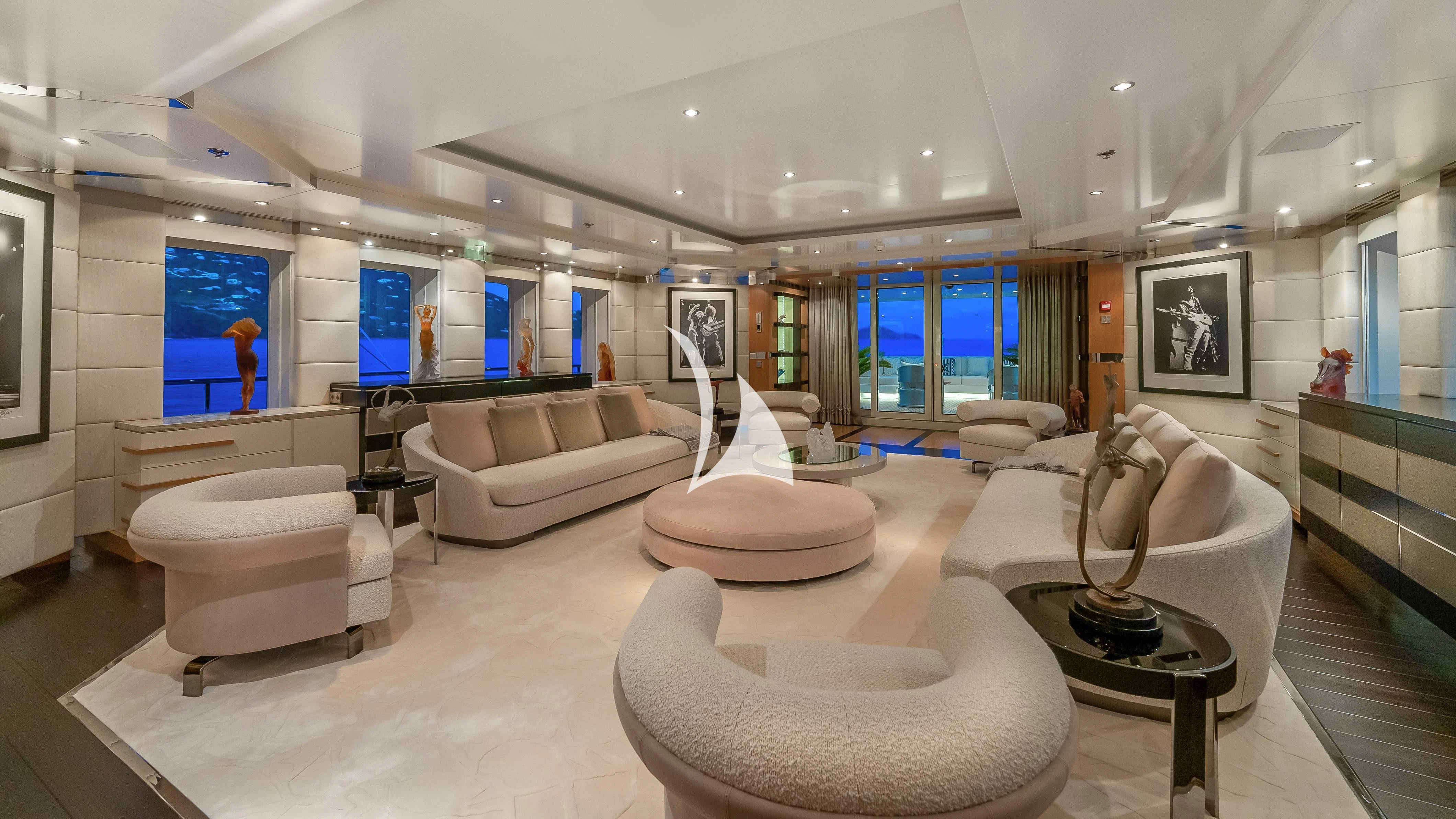 a large room with a couch and a table aboard SCOTT FREE Yacht for Charter